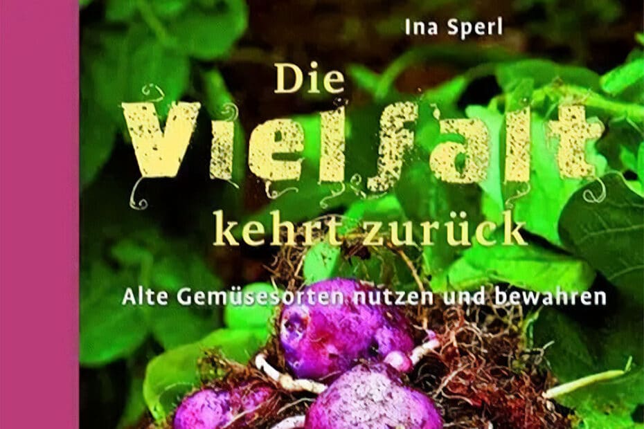 Das Buchcover zeigt grünes Laub und lila Kartoffeln